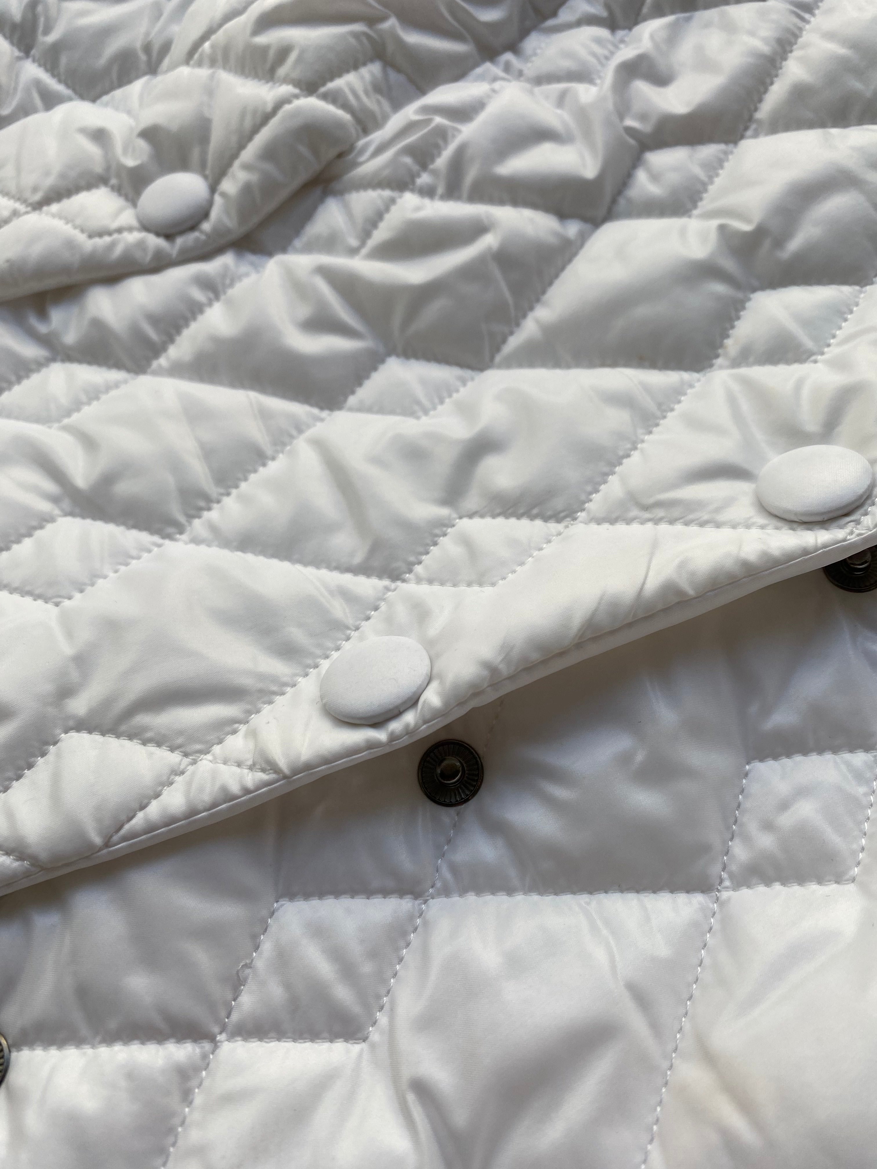 QUILTED SHOULDER CAPE SS/23