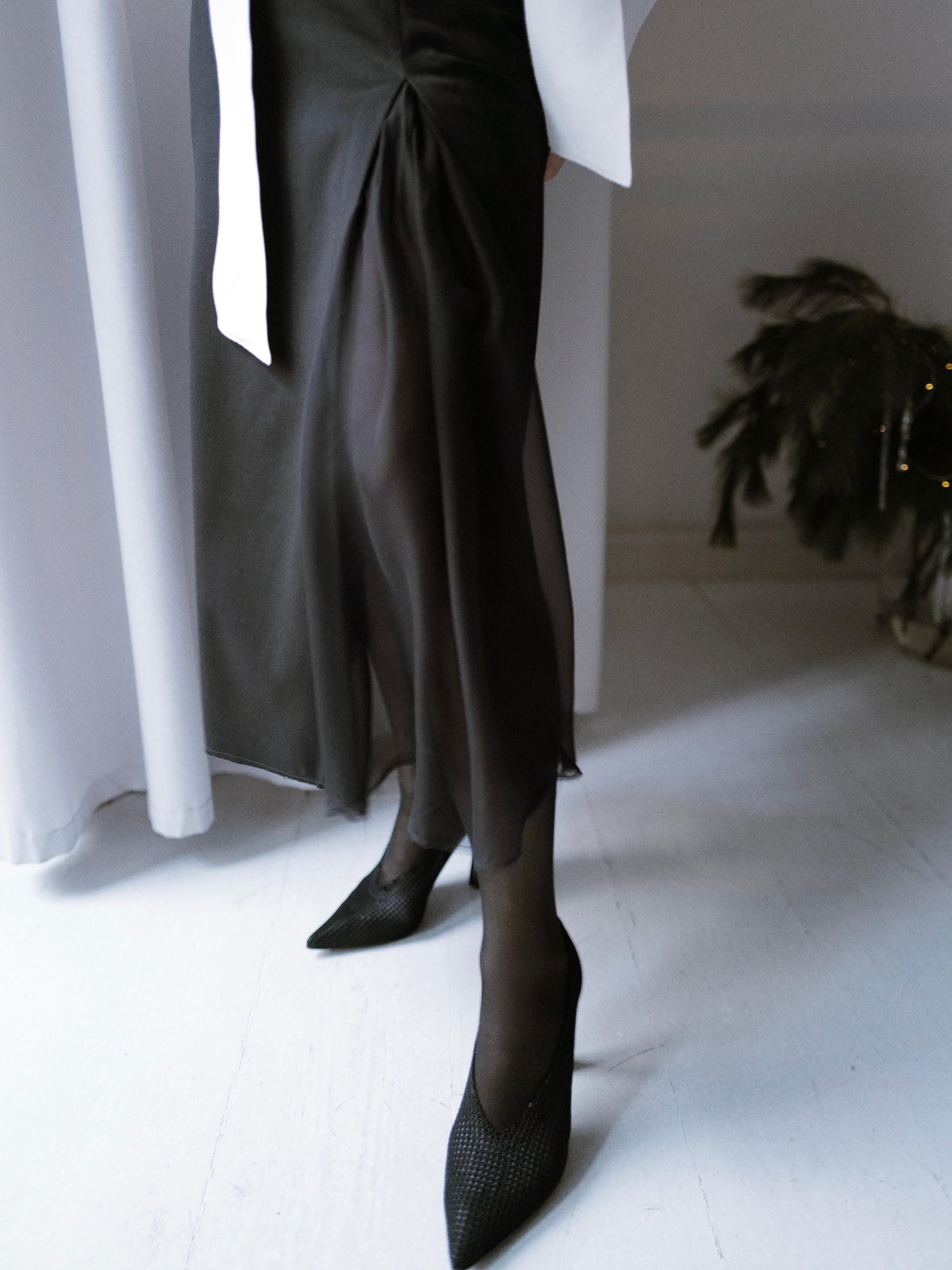 Finest lightweight wool skirt featuring a chiffon slit