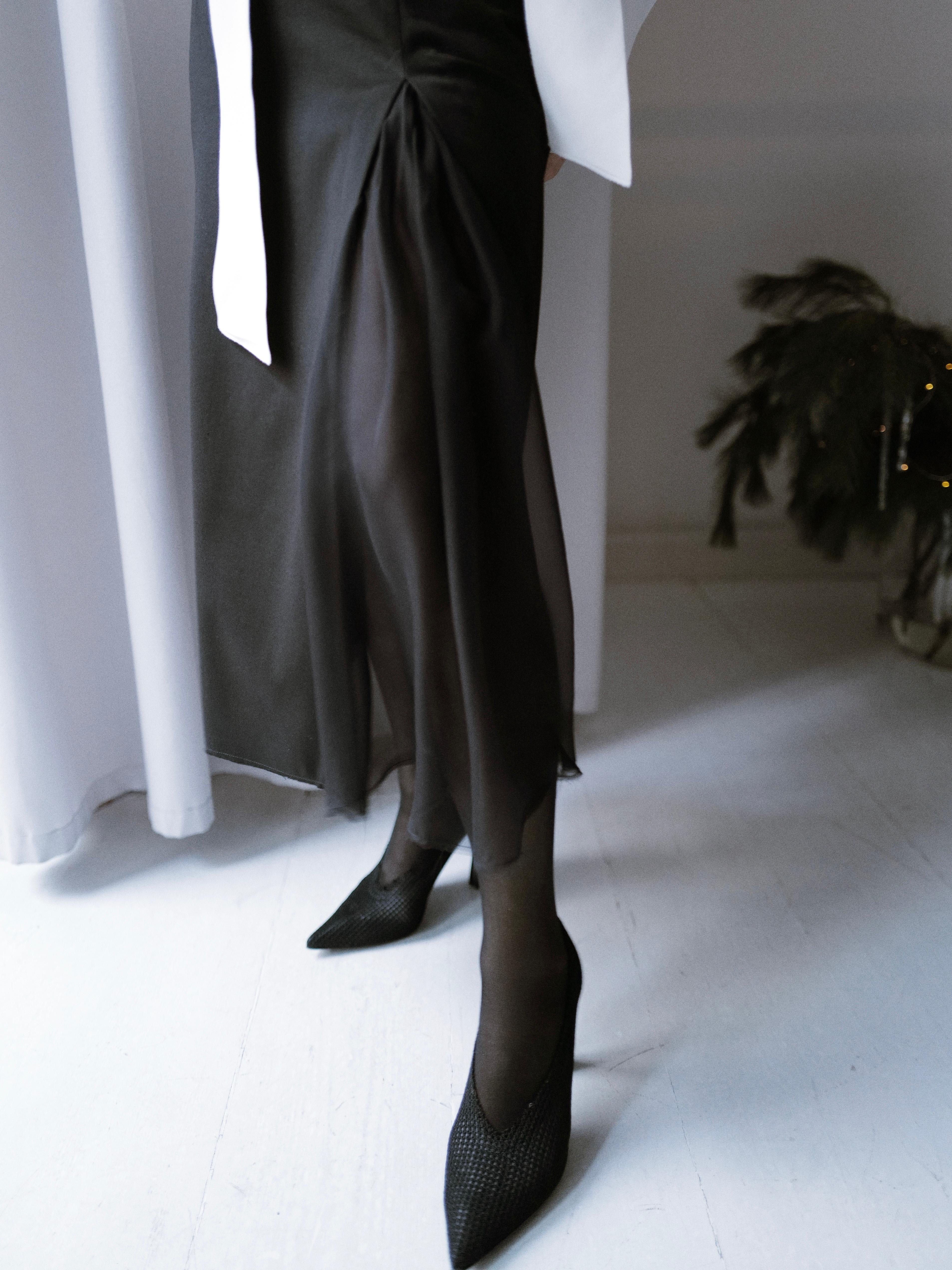 Finest lightweight wool skirt featuring a chiffon slit