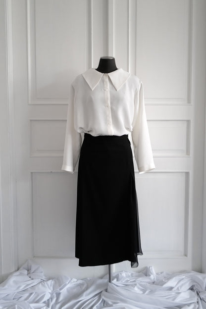 Finest lightweight wool skirt featuring a chiffon slit