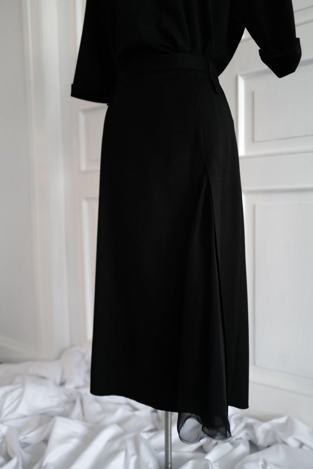 Finest lightweight wool skirt featuring a chiffon slit