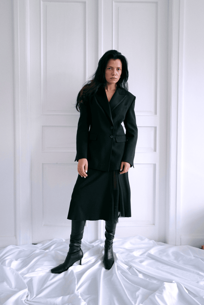 Finest lightweight wool skirt featuring a chiffon slit