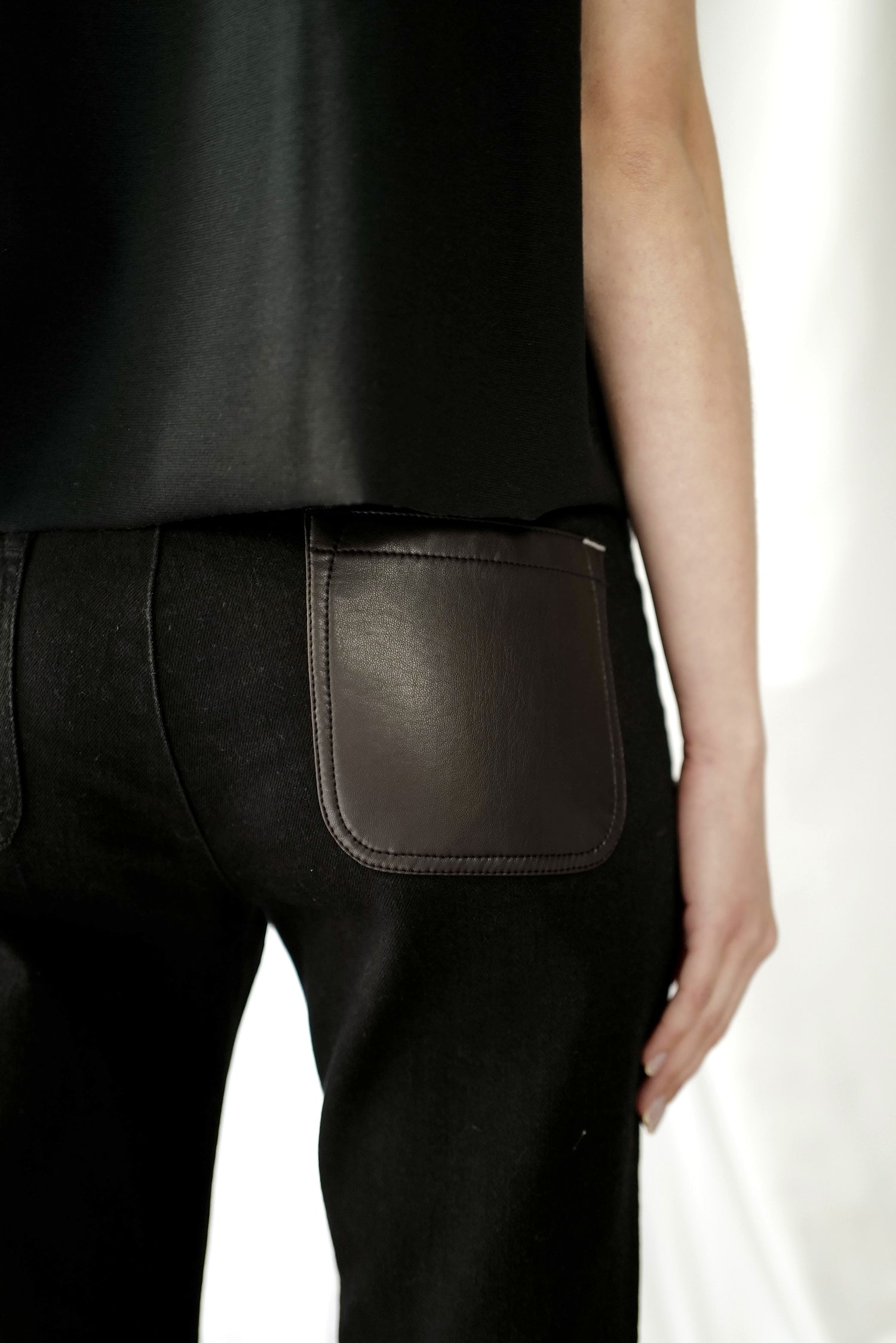 Black Denim High-Rise Flared  Jeans with Eco Leather back pocket.