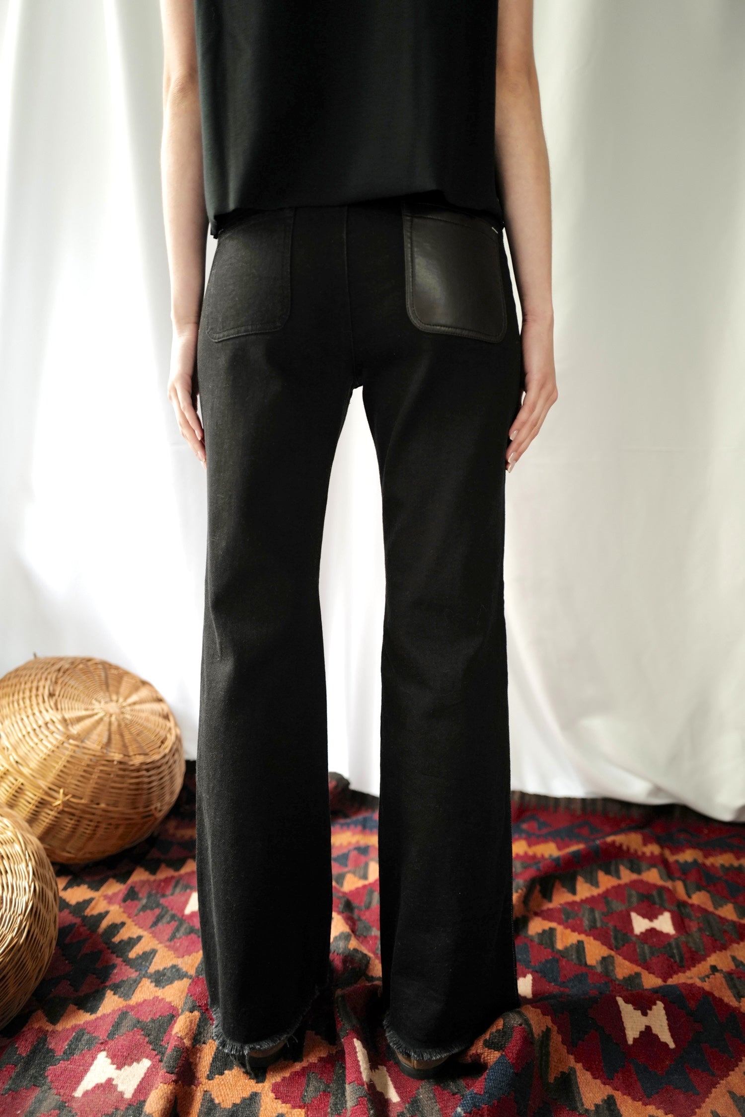 Black Denim High-Rise Flared  Jeans with Eco Leather back pocket.